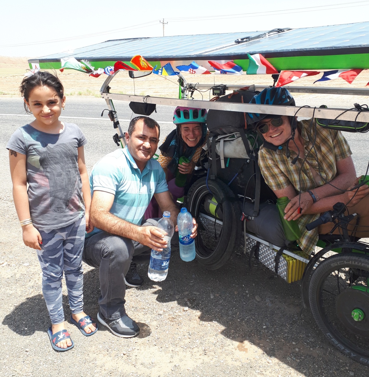We attracted a tremendous amount of attention on the road, and many drivers would pull over to see if there was anything they could offer us. Frozen water bottles was a favorite.